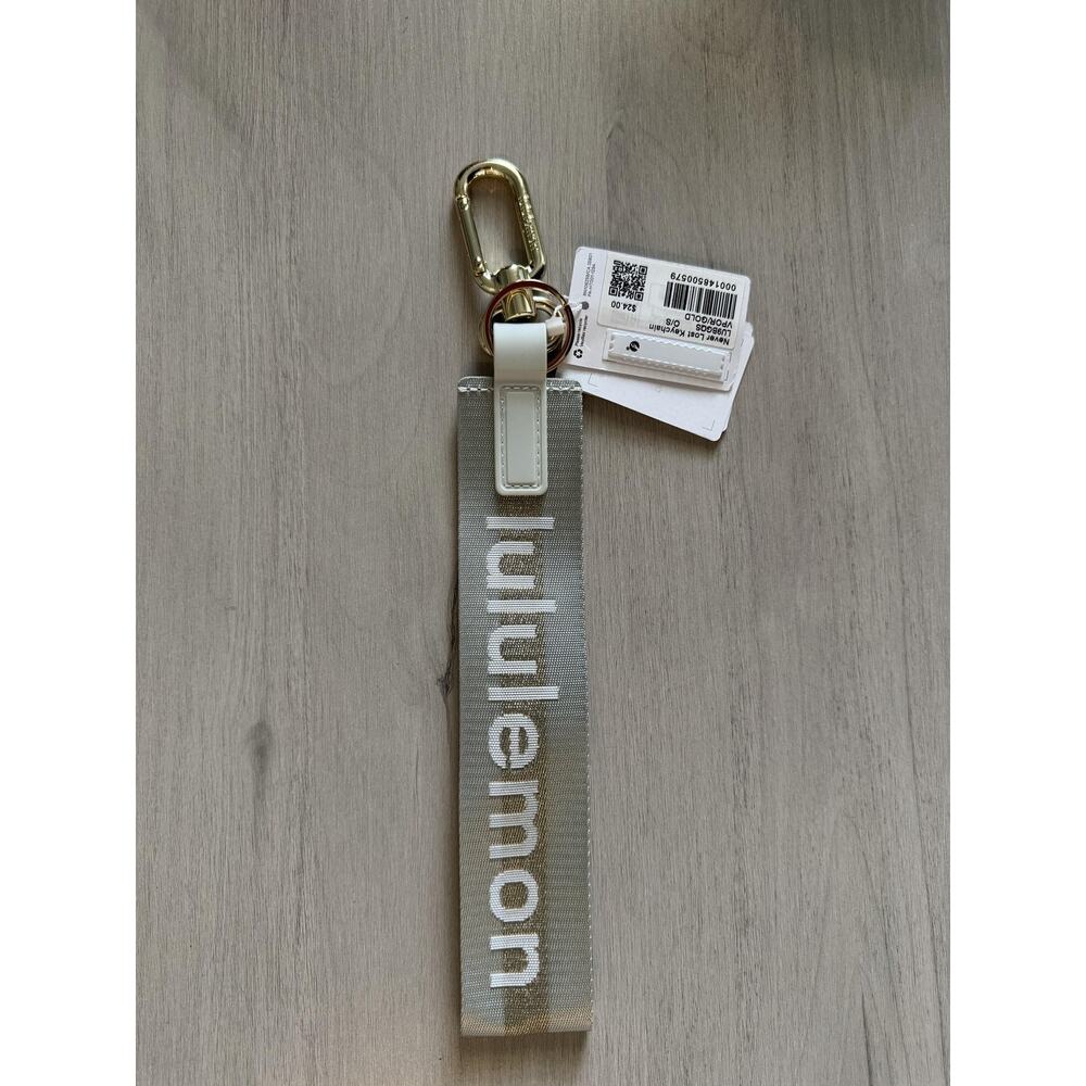 Lululemon Keychain Womens One Size Gray Never Lost Logo Gold Fob Clip Charm